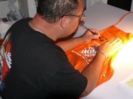 Bruce working late caricaturing the aprons