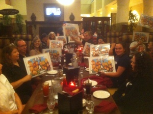 Gang holding up caricatures